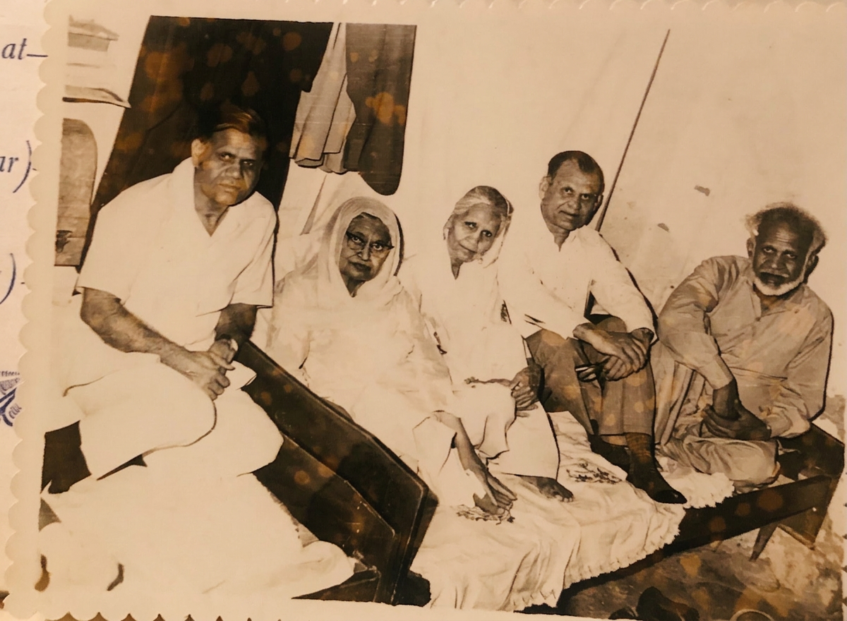 A vintage family photograph of our elders, seated together.